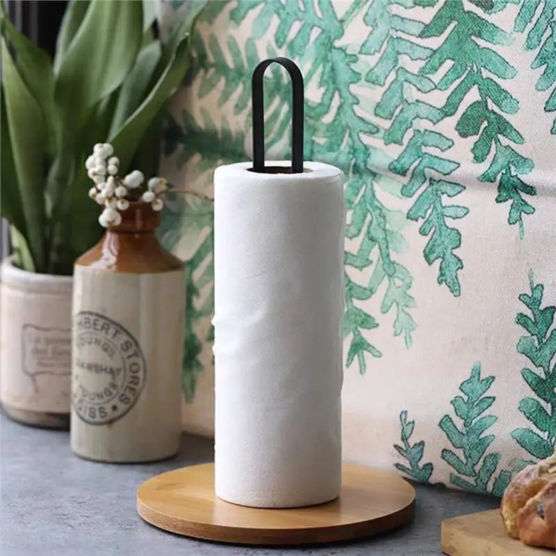 Bamboo base paper towel holder with a roll on a kitchen counter
